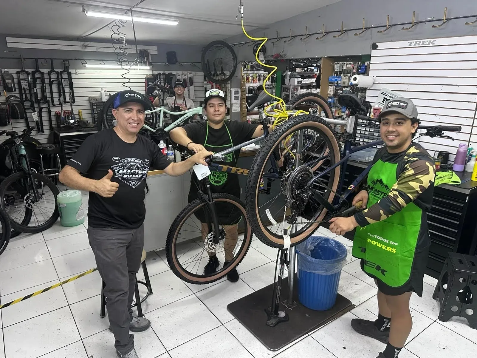 The MASTER BIKES team with a finished Trek bike at the shop in Ciudad Obregon, Sonora